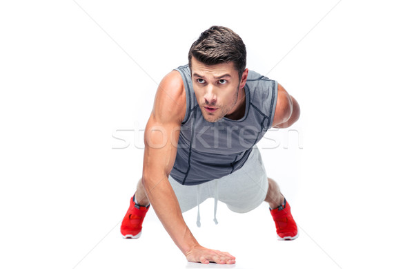 Fitnessz jóképű férfi fekvőtámaszok egy kéz izolált Stock fotó © deandrobot