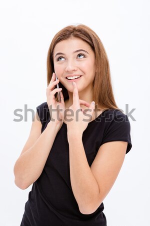 Cute shy curious young female using smartphone Stock photo © deandrobot
