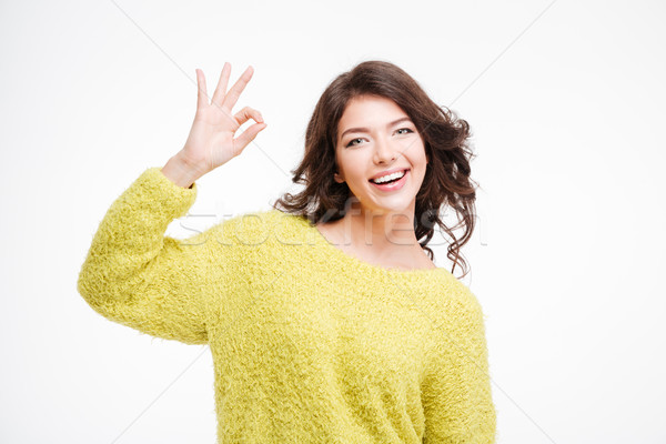 Portrait of a happy woman showing ok sign Stock photo © deandrobot