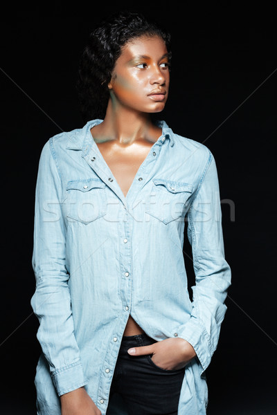 Attractive african young woman with fashion makeup in blue shirt Stock photo © deandrobot