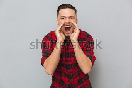 Gritando homem camisas moço mãos cara Foto stock © deandrobot