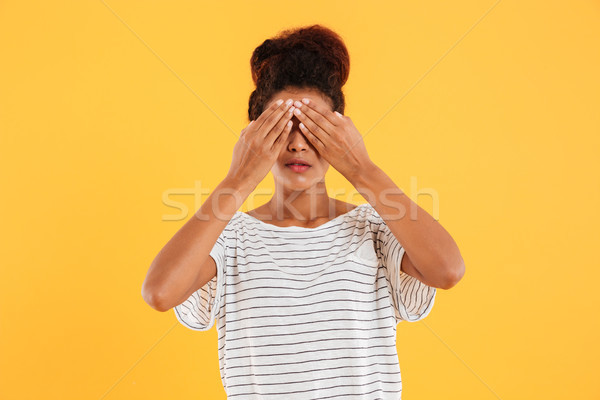 Stock photo: Young woman covering her eyes isolated