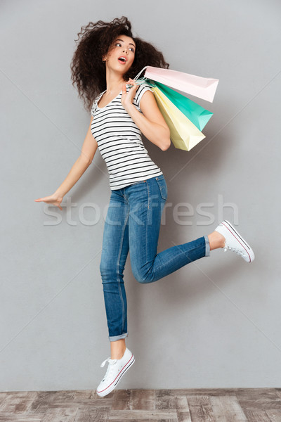 Caucasian brunette female in casual posing on camera with a lot  Stock photo © deandrobot