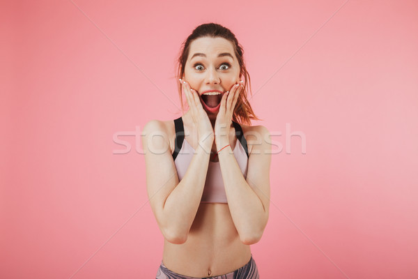 Excited emotional young fitness sports woman Stock photo © deandrobot