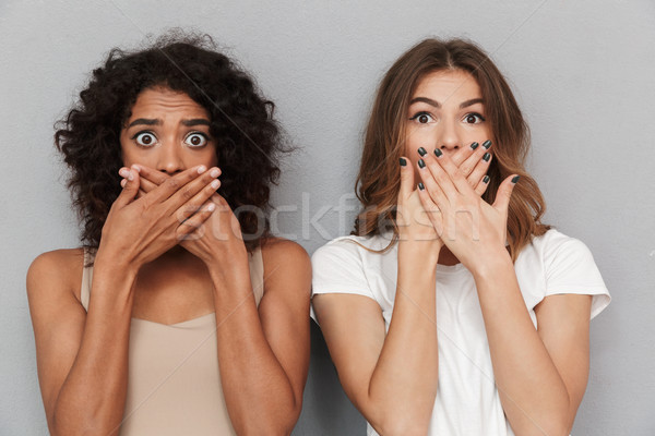 Stock photo: Close up portrait of two shocked women