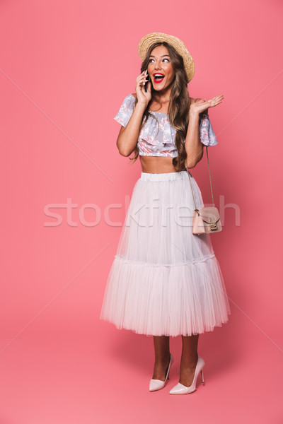 Full length portrait of adorable fashion woman 20s wearing straw Stock photo © deandrobot