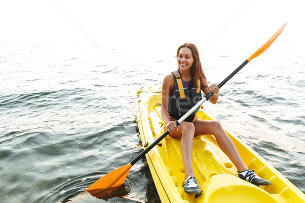 Mooie vrouw kajakken meer zee boot foto Stockfoto © deandrobot