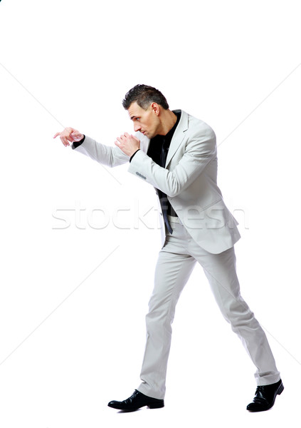 Stock photo: Side view portrait of a businessman punch
