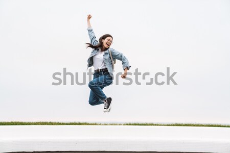 Funny man posing over white background Stock photo © deandrobot