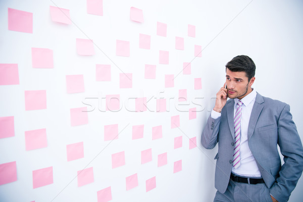 Businessman talking on the phone in office Stock photo © deandrobot