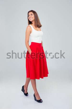 Zamyślony szczęśliwy kobieta spódnica Zdjęcia stock © deandrobot