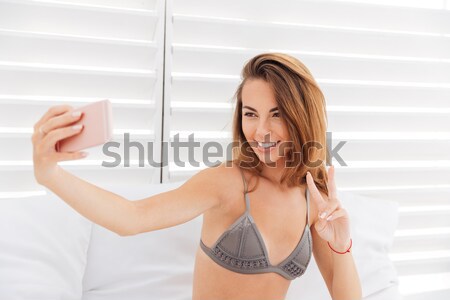Portrait of relaxed young girl in lingerie Stock photo © deandrobot