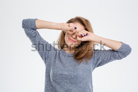 Woman waking up and stretching hands  Stock photo © deandrobot