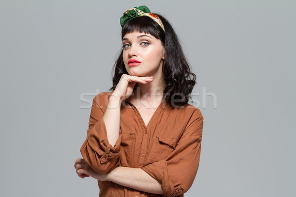 Vonzó figyelmes fiatal nő blúz összehajtva kezek Stock fotó © deandrobot