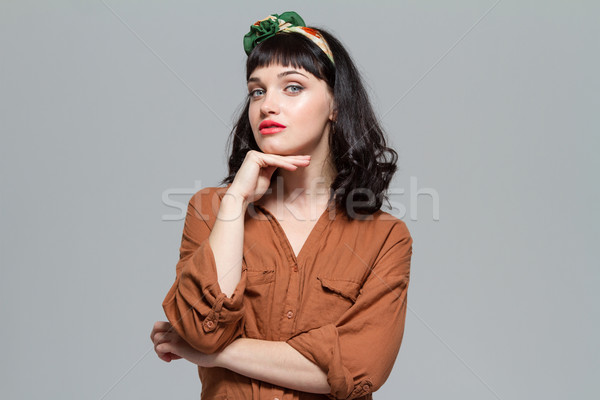 Aantrekkelijk nadenkend jonge vrouw blouse gevouwen handen Stockfoto © deandrobot