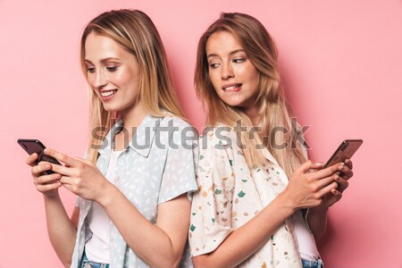 Woman with red phone tube pointing finger at camera Stock photo © deandrobot