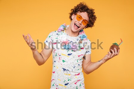 Excited surprised housewife in blue apron and yellow rubber gloves  Stock photo © deandrobot