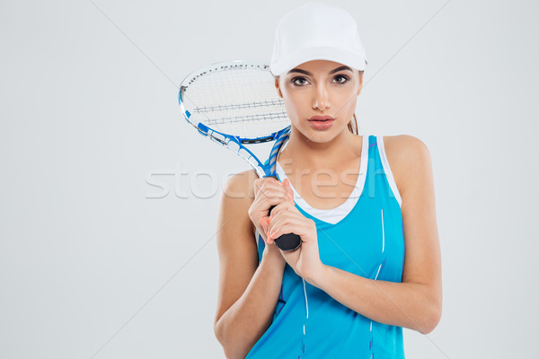 Portrait of a beautiful woman holding tennis racquet Stock photo © deandrobot