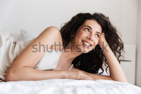 Close-up portrait of a smiling girl in bed Stock photo © deandrobot