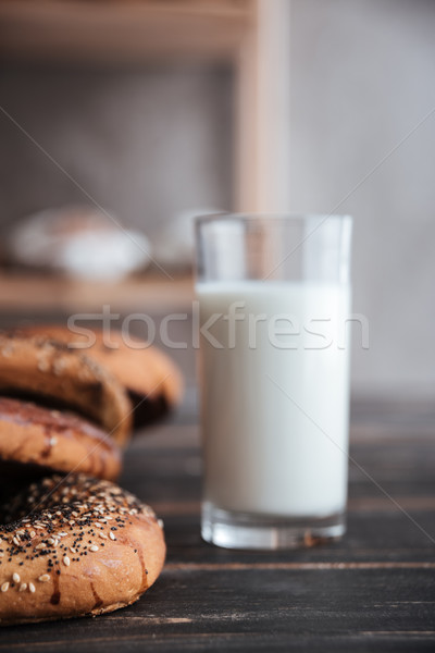 Sütemények üveg tej sötét fa asztal kép Stock fotó © deandrobot