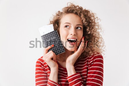 Happy young lady indoors with gift boxes. Stock photo © deandrobot