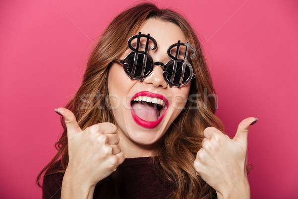 Close up portrait of a successful happy girl Stock photo © deandrobot
