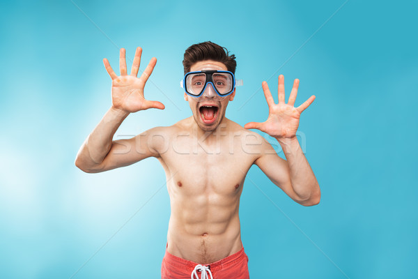 Portrait of a cheerful young shirtless man in swim mask Stock photo © deandrobot