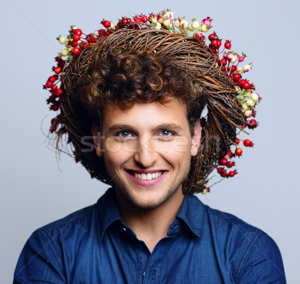 Portrait of a laughing happy man with wreath Stock photo © deandrobot