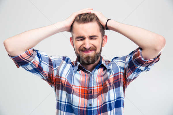 Portrait of upset young man  Stock photo © deandrobot