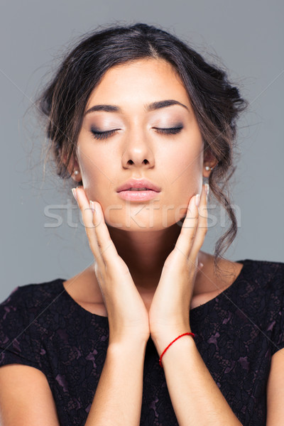 Charming woman with closed eyes Stock photo © deandrobot