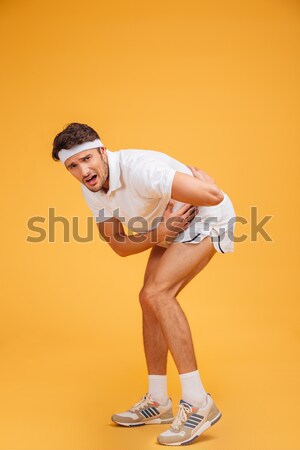 Portrait of a handsome young man playing basketball Stock photo © deandrobot