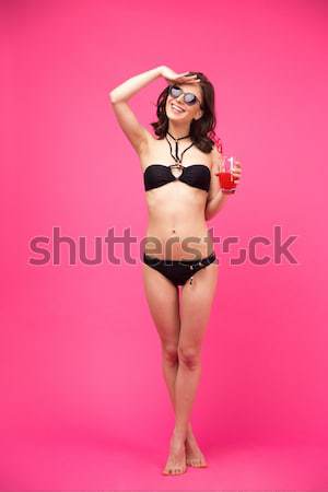 Sexy beautiful young beach girl posing with air mattress Stock photo © deandrobot