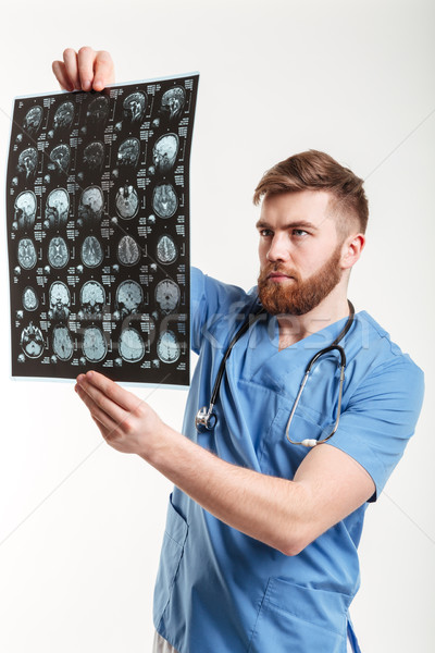 Portret jonge medische arts scannen geïsoleerd Stockfoto © deandrobot