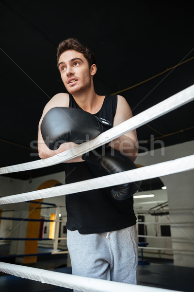 Jeune homme gants de boxe homme sport [[stock_photo]] © deandrobot