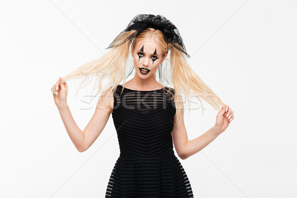 Anziehend blonde Frau schwarz Witwe Kostüm posiert Stock foto © deandrobot