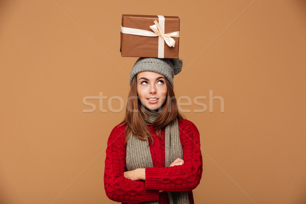 Thoughtful beautiful girl in winter clothes standing with crosse Stock photo © deandrobot