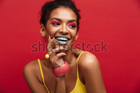 Colorful portrait of mulatto woman with stylish makeup emotional Stock photo © deandrobot