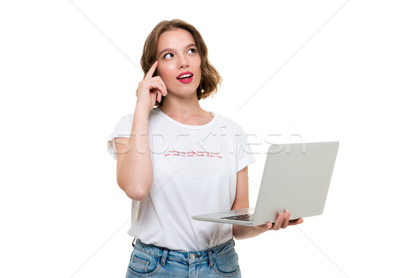 Portré figyelmes nő tart laptop számítógép áll Stock fotó © deandrobot
