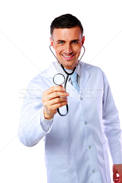 Cheerful male doctor holding stethoscope over white background Stock photo © deandrobot