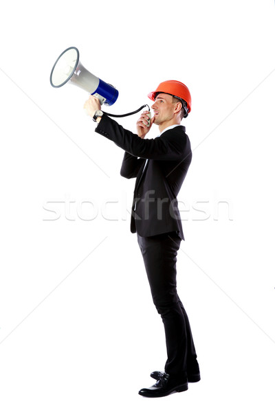 Full-length portrait of a businessman shouting with megaphone over white background Stock photo © deandrobot