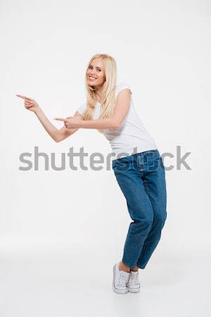 Happy female teenager making selfie photo on smartphone  Stock photo © deandrobot