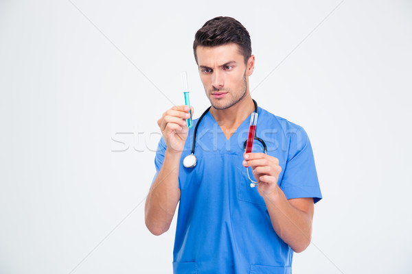 Portrait of a male doctor with test tube Stock photo © deandrobot