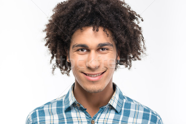 Smiling afro american man with curly hair Stock photo © deandrobot