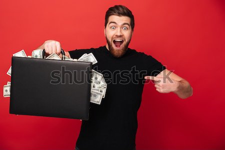 Derűs üzletember tart eljegyzési gyűrű izolált fehér Stock fotó © deandrobot