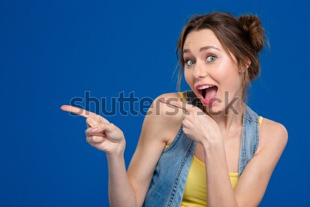 Portrait of attractive pretty young woman with chilli pepper  Stock photo © deandrobot