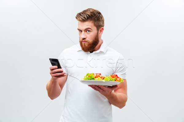 Foto stock: Moço · prato · vegetal · telefone · móvel · jovem