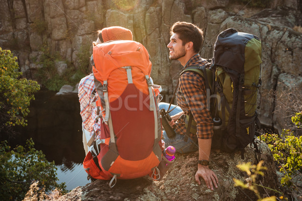 Back view of young adventure couple Stock photo © deandrobot