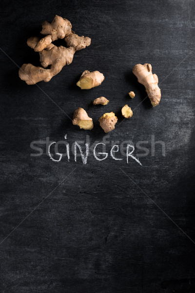 Ginger over dark chalkboard background Stock photo © deandrobot
