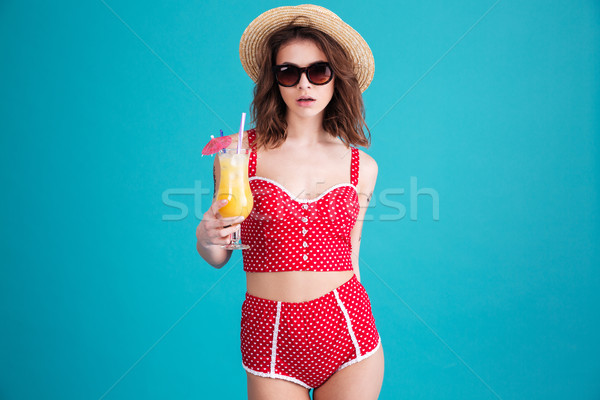 Amazing young lady with cocktail looking at camera Stock photo © deandrobot