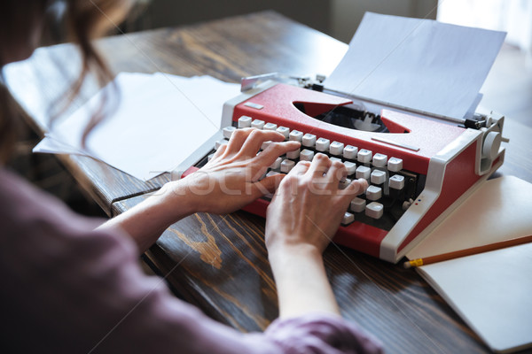 Close up portrait of an authoress sitting at the table Stock photo © deandrobot